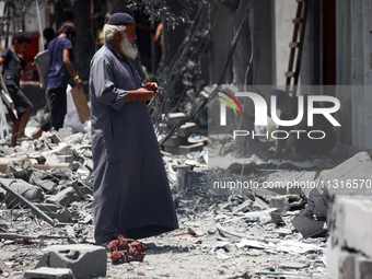 Palestinians are inspecting the damage and debris a day after an operation by the Israeli Special Forces in the Nuseirat camp, in the centra...