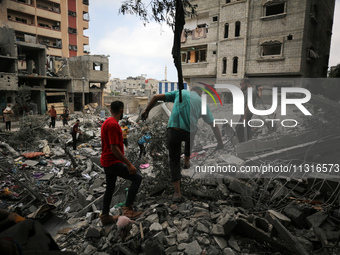 Palestinians are inspecting the damage and debris a day after an operation by the Israeli Special Forces in the Nuseirat camp, in the centra...