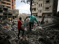 Palestinians are inspecting the damage and debris a day after an operation by the Israeli Special Forces in the Nuseirat camp, in the centra...