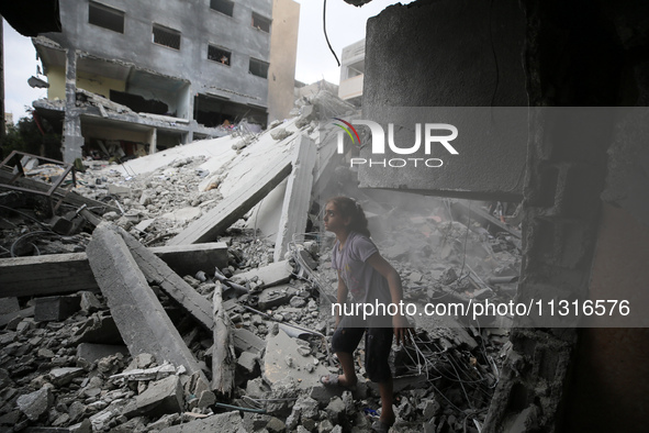 Palestinians are inspecting the damage and debris a day after an operation by the Israeli Special Forces in the Nuseirat camp, in the centra...