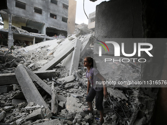 Palestinians are inspecting the damage and debris a day after an operation by the Israeli Special Forces in the Nuseirat camp, in the centra...