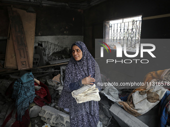 Palestinians are inspecting the damage and debris a day after an operation by the Israeli Special Forces in the Nuseirat camp, in the centra...