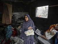 Palestinians are inspecting the damage and debris a day after an operation by the Israeli Special Forces in the Nuseirat camp, in the centra...