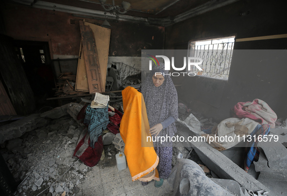 Palestinians are inspecting the damage and debris a day after an operation by the Israeli Special Forces in the Nuseirat camp, in the centra...