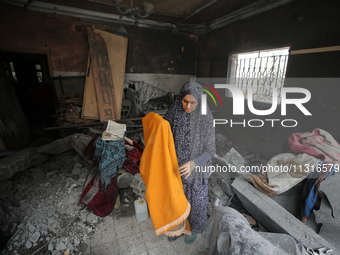 Palestinians are inspecting the damage and debris a day after an operation by the Israeli Special Forces in the Nuseirat camp, in the centra...