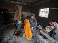 Palestinians are inspecting the damage and debris a day after an operation by the Israeli Special Forces in the Nuseirat camp, in the centra...