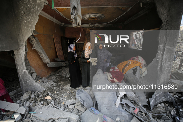 Palestinians are inspecting the damage and debris a day after an operation by the Israeli Special Forces in the Nuseirat camp, in the centra...