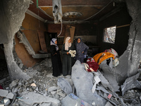 Palestinians are inspecting the damage and debris a day after an operation by the Israeli Special Forces in the Nuseirat camp, in the centra...