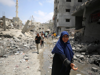 Palestinians are inspecting the damage and debris a day after an operation by the Israeli Special Forces in the Nuseirat camp, in the centra...