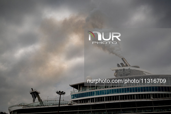 The smokestacks of the Oasis of the Seas cruise ship are giving off smoke in the port of Barcelona, Spain, on June 9, 2024. Sulphur oxide an...