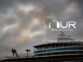 The smokestacks of the Oasis of the Seas cruise ship are giving off smoke in the port of Barcelona, Spain, on June 9, 2024. Sulphur oxide an...