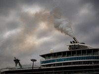 The smokestacks of the Oasis of the Seas cruise ship are giving off smoke in the port of Barcelona, Spain, on June 9, 2024. Sulphur oxide an...