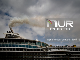 The smokestacks of the Oasis of the Seas cruise ship are giving off smoke in the port of Barcelona, Spain, on June 9, 2024. Sulphur oxide an...