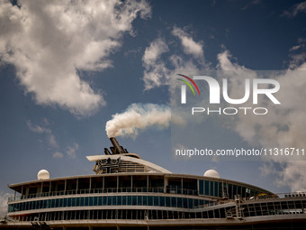 The smokestacks of the Oasis of the Seas cruise ship are giving off smoke in the port of Barcelona, Spain, on June 9, 2024. Sulphur oxide an...