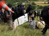 The black bloc is preparing to confront riot police. Nearly 5,000 people are participating in a weekend of action called 'Roue Libre' in the...