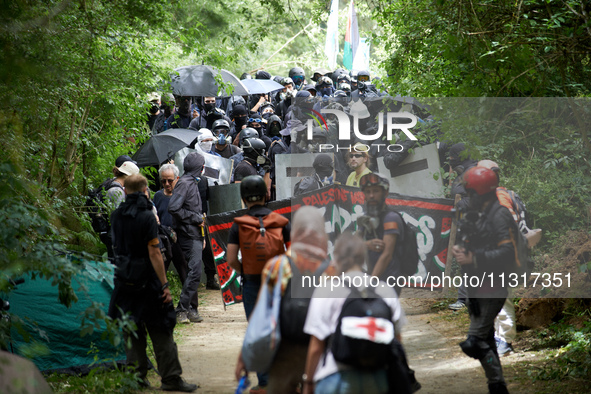 The black bloc is going to an objective of the protest. Nearly 5,000 people are participating in a weekend of action called 'Roue Libre' in...