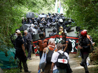 The black bloc is going to an objective of the protest. Nearly 5,000 people are participating in a weekend of action called 'Roue Libre' in...