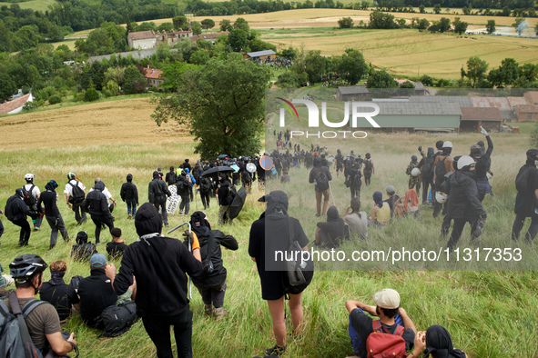 The black bloc is going to an objective of the protest. Nearly 5,000 people are participating in a weekend of action called 'Roue Libre' in...