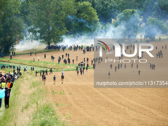 The black bloc is confronting riot police. Nearly 5,000 people are participating in a weekend of action called 'Roue Libre' in the Tarn depa...