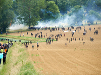 The black bloc is confronting riot police. Nearly 5,000 people are participating in a weekend of action called 'Roue Libre' in the Tarn depa...