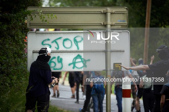 A protester is writing 'Stop to the A69'. Nearly 5,000 people are participating in a weekend of action called 'Roue Libre' in the Tarn depar...