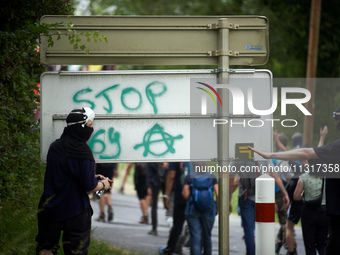 A protester is writing 'Stop to the A69'. Nearly 5,000 people are participating in a weekend of action called 'Roue Libre' in the Tarn depar...