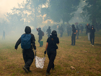 Black bloc is confronting riot police amid clouds of tear gas and smoke. Nearly 5,000 people are participating in a weekend of action called...