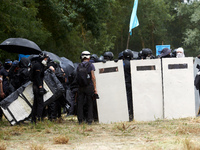 Black bloc are preparing to go to an objective of the protest. Nearly 5,000 people are participating in a weekend of action called 'Roue Lib...