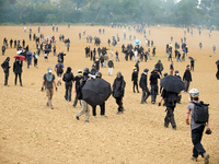 Black bloc is standing in a field during skirmishes with riot police. Nearly 5,000 people are participating in a weekend of action called 'R...