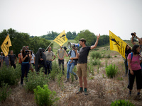 A member of the farmers' union Confederation Paysanne is making a speech in a field that will be destroyed by the A69 highway. Nearly 5,000...