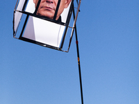 A demonstrator carries a rendition of Israeli Prime Minister Benjamin Netanyahu behind bars during a protest at the White House, Washington,...