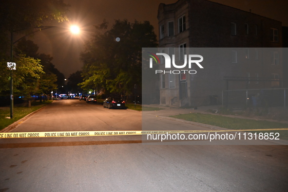 FILE PHOTO: Police tape is seen at a shooting scene in Chicago, Illinois. A 19-year-old male victim is being critically wounded in a shootin...