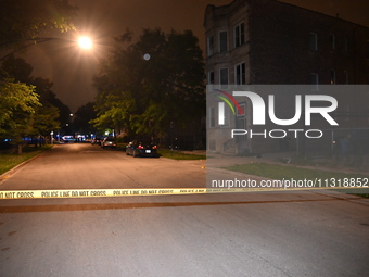 FILE PHOTO: Police tape is seen at a shooting scene in Chicago, Illinois. A 19-year-old male victim is being critically wounded in a shootin...