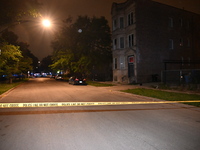 FILE PHOTO: Police tape is seen at a shooting scene in Chicago, Illinois. A 19-year-old male victim is being critically wounded in a shootin...