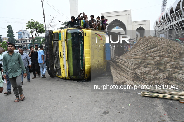 People gathered at the site of a truck accident in Dhaka, Bangladesh, on June 10, 2024. 