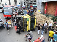 People gathered at the site of a truck accident in Dhaka, Bangladesh, on June 10, 2024. (