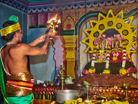 A Tamil Hindu priest is performing special prayers during the 10th night of the Pathirakali Amman festival at the Pathirakali Amman Kovil (P...