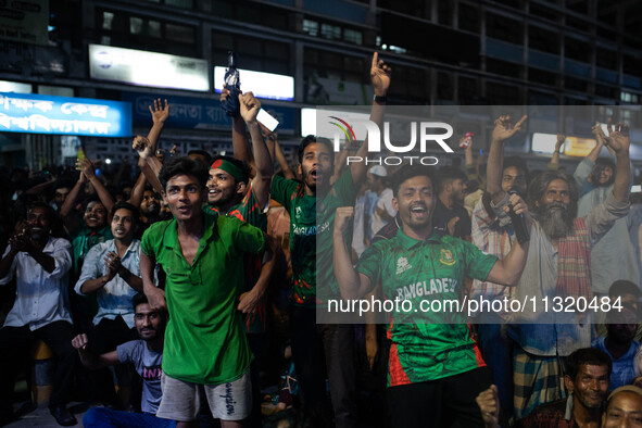 Bangladeshi fans are enjoying a cricket match between Bangladesh and South Africa on a giant screen during the ICC Men's T20 World Cup at TS...