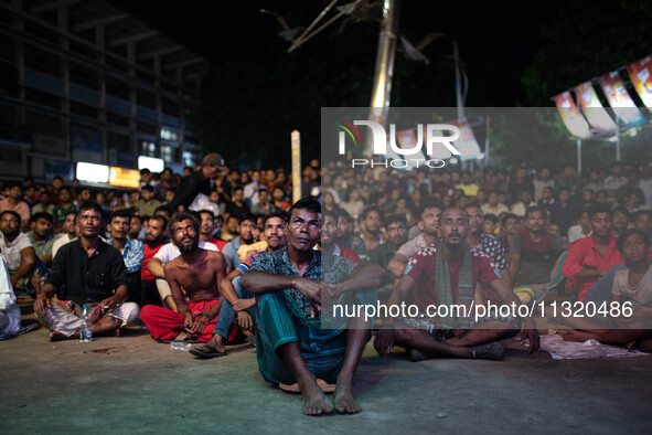 Bangladeshi fans are enjoying a cricket match between Bangladesh and South Africa on a giant screen during the ICC Men's T20 World Cup at TS...