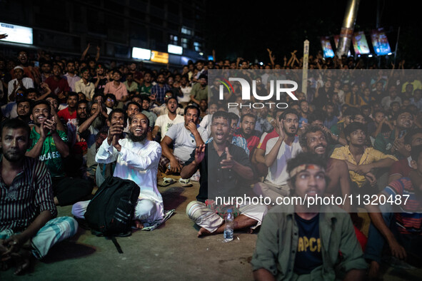 Bangladeshi fans are enjoying a cricket match between Bangladesh and South Africa on a giant screen during the ICC Men's T20 World Cup at TS...