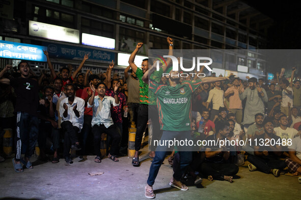 Bangladeshi fans are enjoying a cricket match between Bangladesh and South Africa on a giant screen during the ICC Men's T20 World Cup at TS...