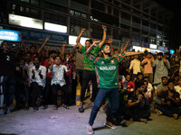 Bangladeshi fans are enjoying a cricket match between Bangladesh and South Africa on a giant screen during the ICC Men's T20 World Cup at TS...