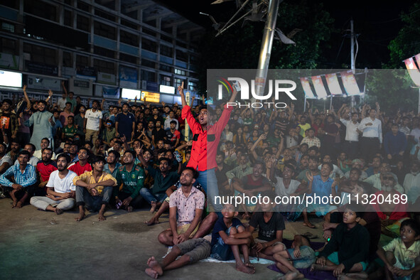 Bangladeshi fans are enjoying a cricket match between Bangladesh and South Africa on a giant screen during the ICC Men's T20 World Cup at TS...