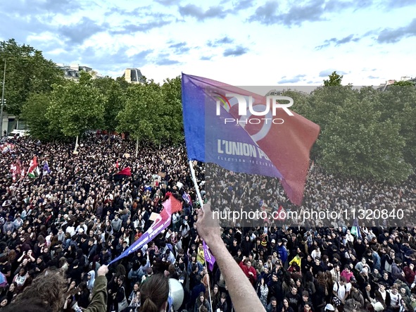 Protesters gather during a demonstration at the Place de la Republique against the victory of the French far-right party Rassemblement Natio...