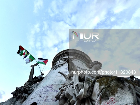 Protesters gather during a demonstration at the Place de la Republique against the victory of the French far-right party Rassemblement Natio...