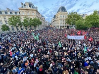 Protesters gather during a demonstration at the Place de la Republique against the victory of the French far-right party Rassemblement Natio...