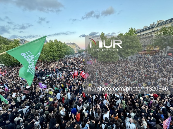 Protesters gather during a demonstration at the Place de la Republique against the victory of the French far-right party Rassemblement Natio...