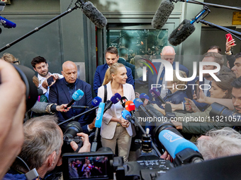 French far-right Reconquete party lead candidate Marion Marechal speaks to media representatives outside the Rassemblement National (RN) par...