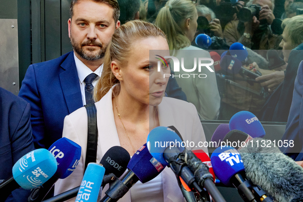 French far-right Reconquete party lead candidate Marion Marechal speaks to media representatives outside the Rassemblement National (RN) par...