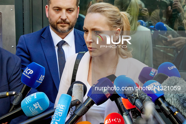 French far-right Reconquete party lead candidate Marion Marechal speaks to media representatives outside the Rassemblement National (RN) par...